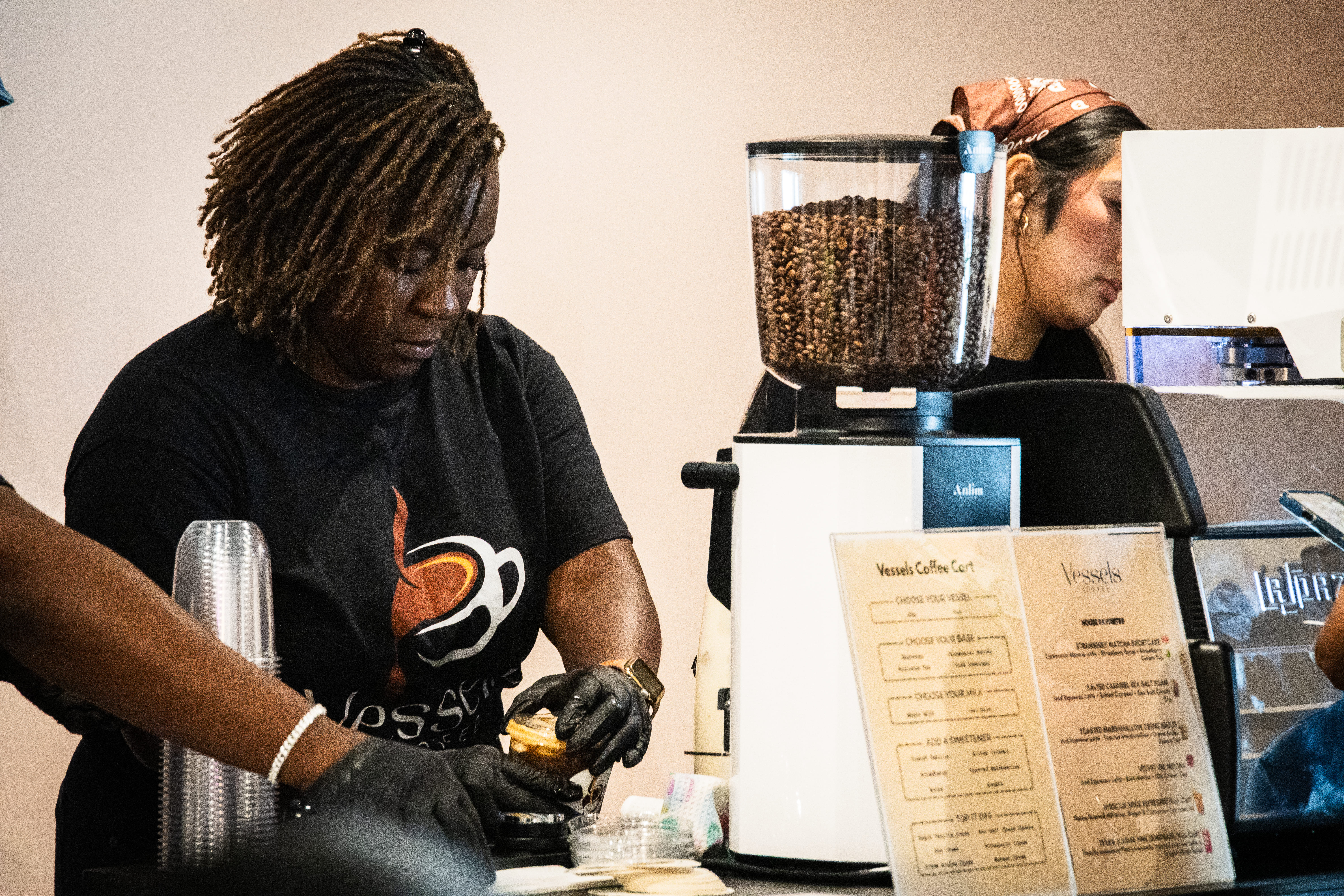 Barista pouring a drink at the Launch Party
