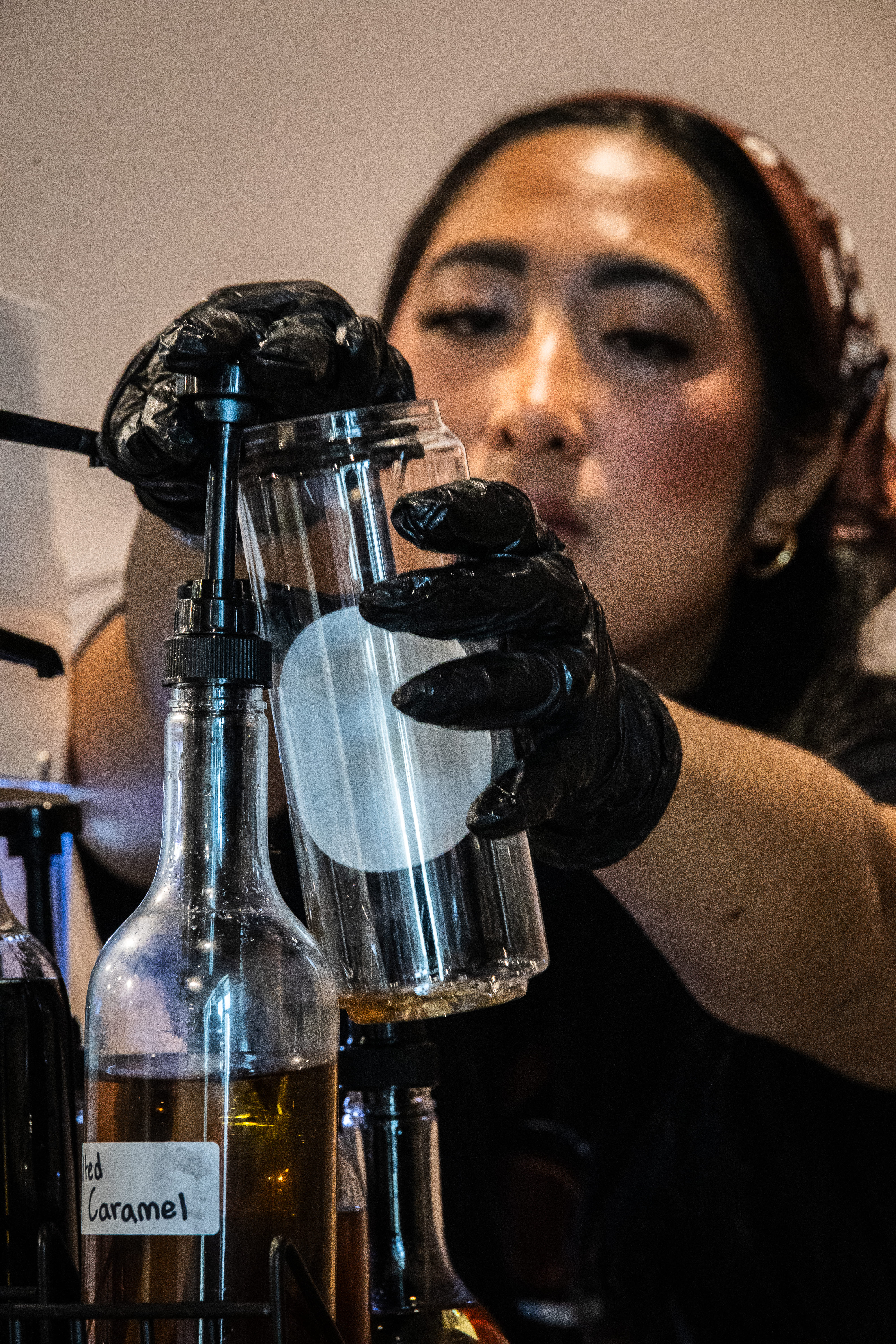 Barista setting up a Latte to be canned