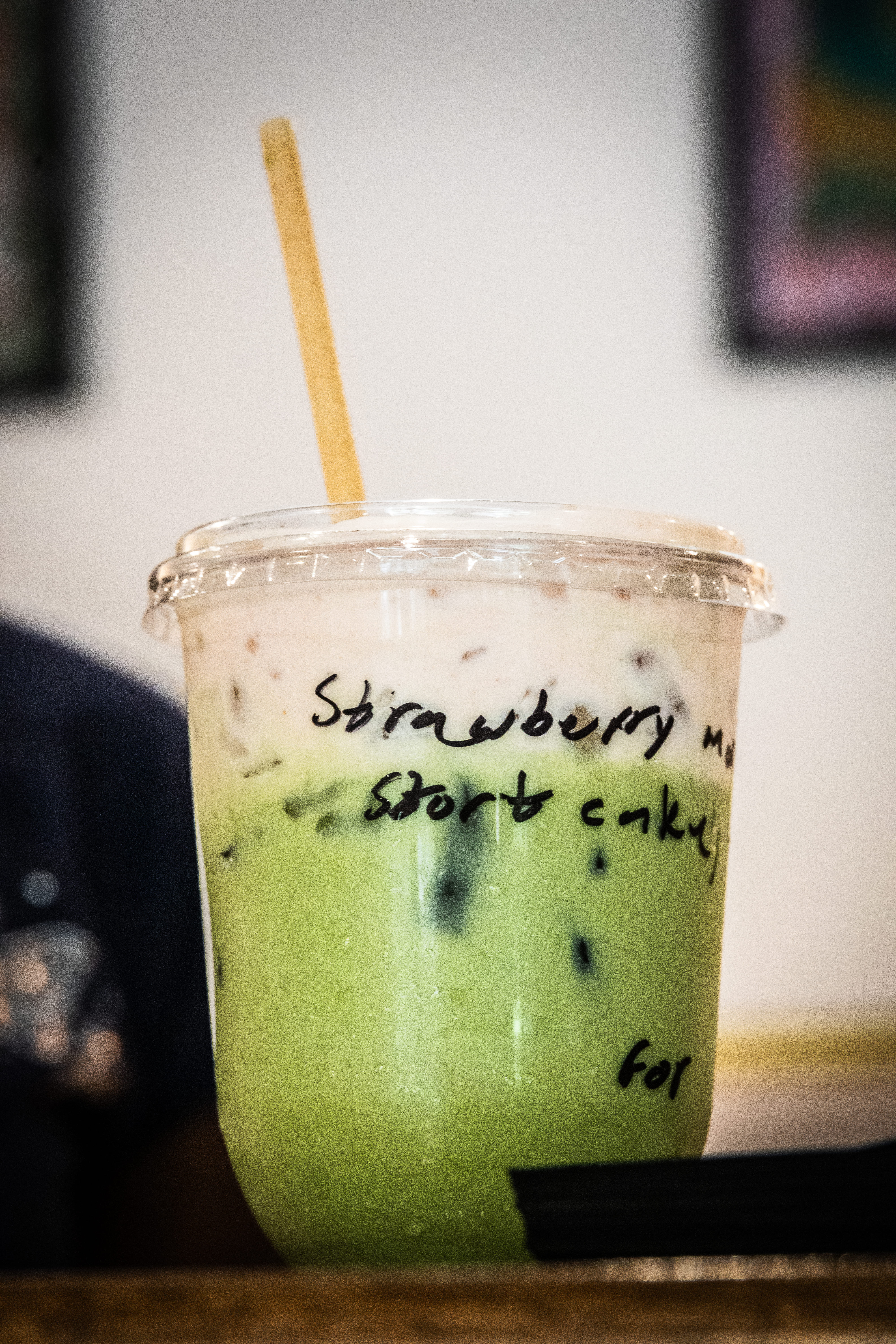 Strawberry Shortcake Matcha Latte with a Straw